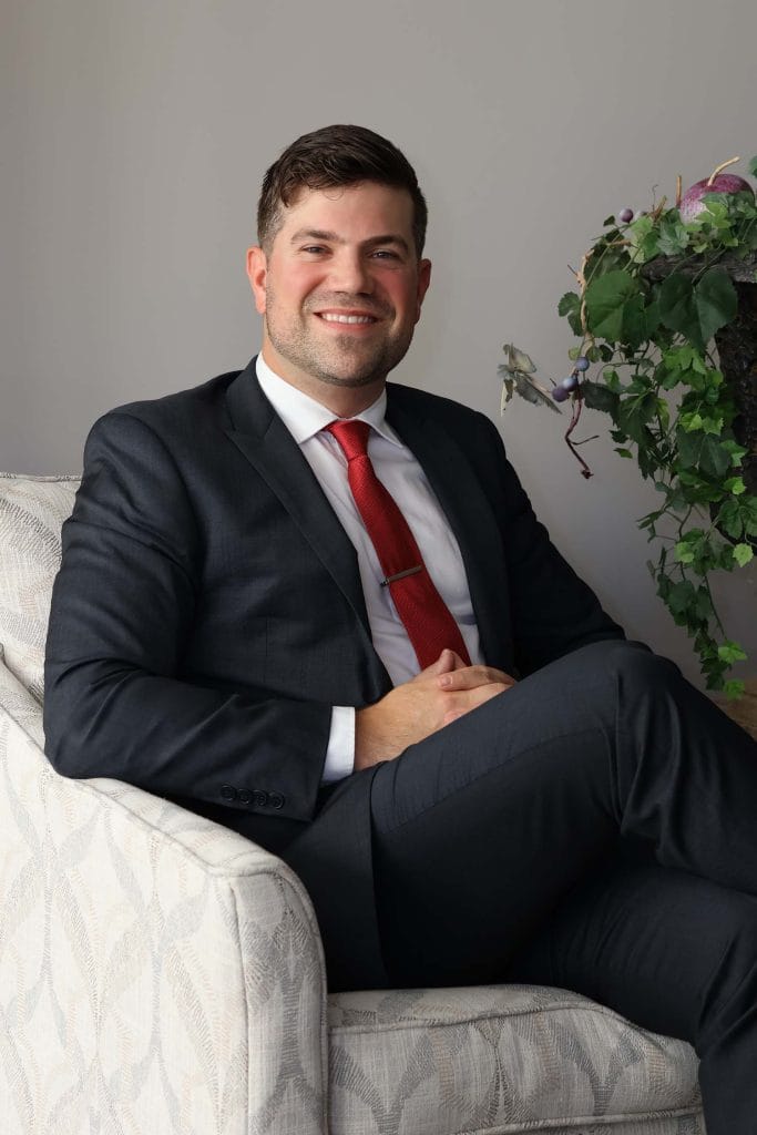 Dr. Randall in a suit, showcasing his professional expertise as a facial plastic surgeon in Morristown, NJ.
