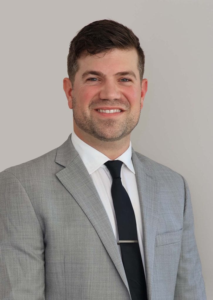 Dr. Randall in a suit, showcasing his professional expertise as a facial plastic surgeon in Morristown, NJ.