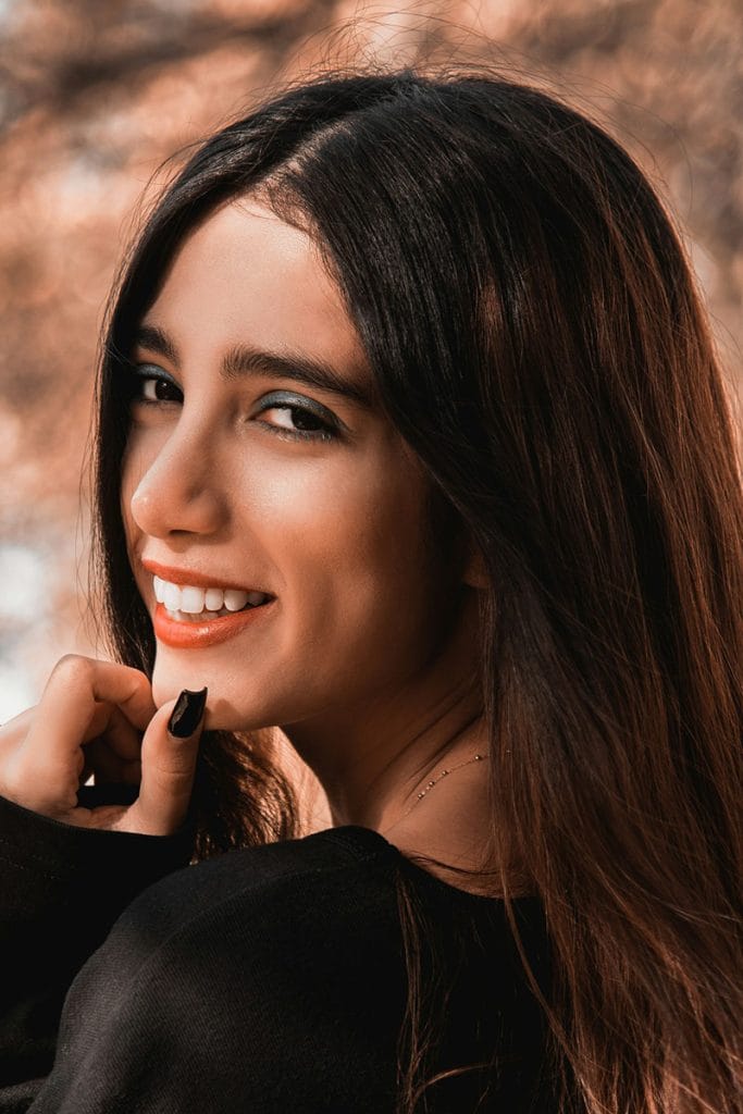 A woman with defined facial contours often seen in results from a buccal fat removal with Dr. Randall in Morristown, NJ