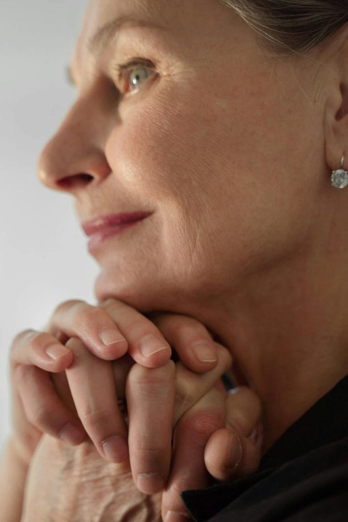 An older beautiful woman smiles showcasing her beautiful, radiant skin- emulating possible outcomes of laser resurfacing by Dr. Randall in Morristown, NJ